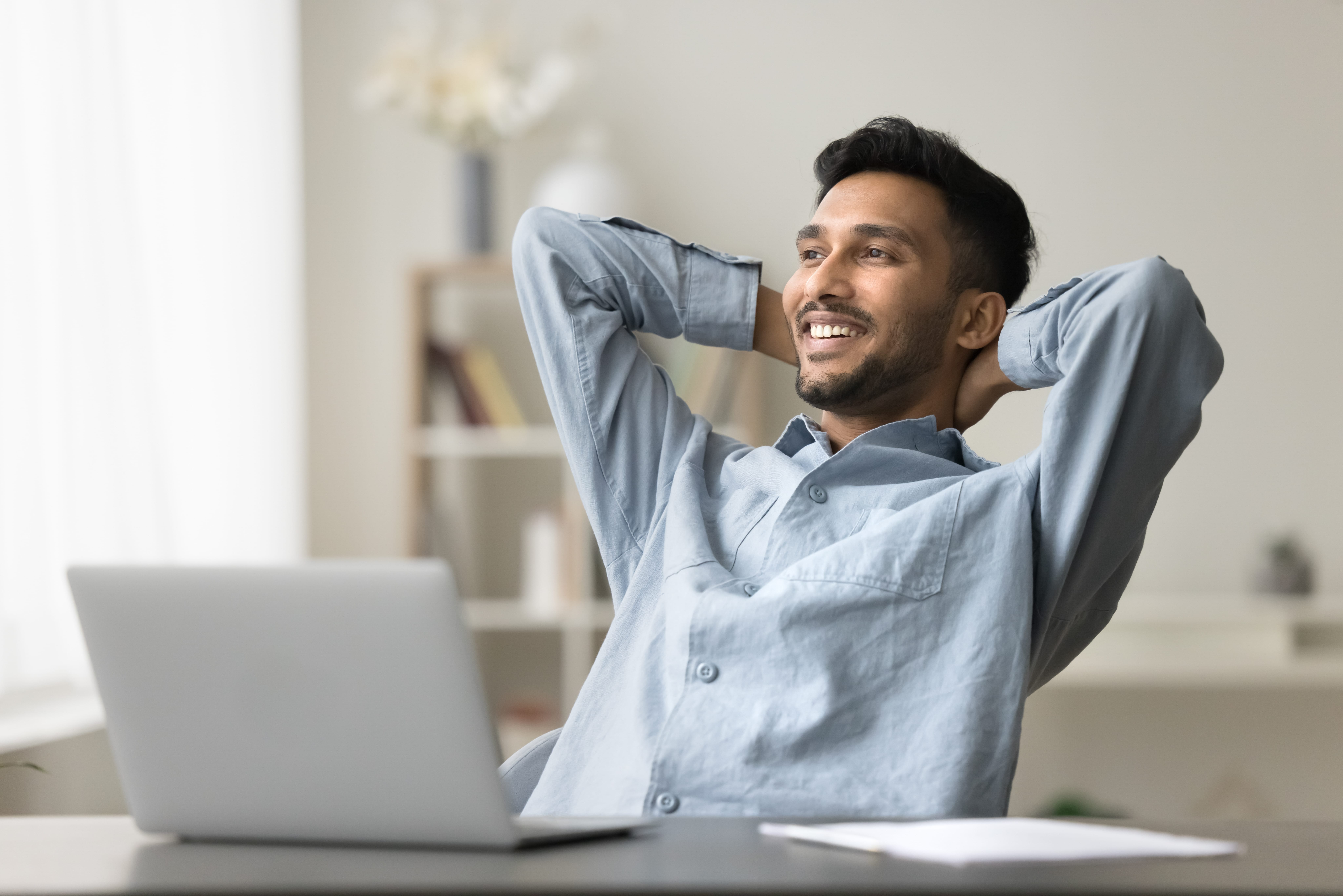 Happy business owner at computer